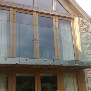 Glass wood balcony and extension, refurbishment of Cotswold stone house
