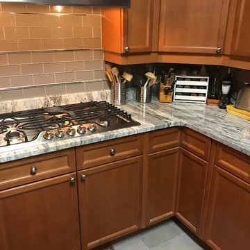 Welcoming, traditional design kitchen in "Thunder White" granite countertops