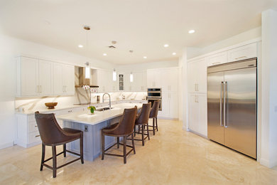Example of a huge trendy l-shaped porcelain tile and beige floor eat-in kitchen design in Miami with an undermount sink, shaker cabinets, white cabinets, quartz countertops, white backsplash, stone tile backsplash, stainless steel appliances and an island