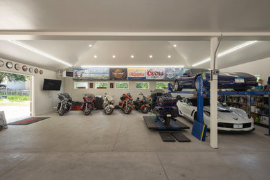 Huge transitional attached four-car garage photo in Minneapolis