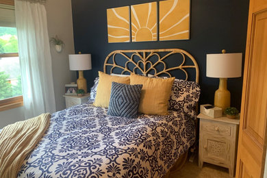 Example of a mid-sized transitional guest bedroom design in Other with blue walls
