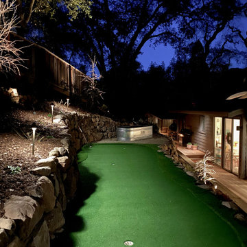 Challenging Hillside Putting green and Fire pit area