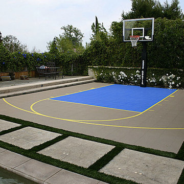 Landscape designed around Custom Backyard Court for a Sport enthusiast Family