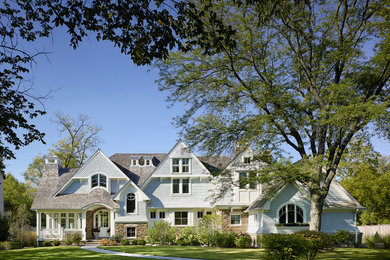 Example of a classic two-story wood gable roof design in Baltimore