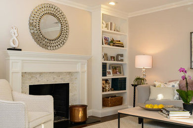 Example of a large transitional formal and enclosed dark wood floor living room design in New York with beige walls, a standard fireplace, a stone fireplace and no tv