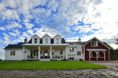 Large elegant white two-story wood gable roof photo in Denver