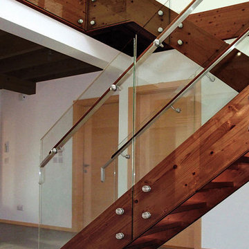 Substantial Floating Staircase in Wood with Glass Railings