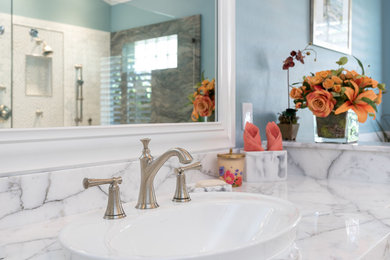Bathroom - mid-sized transitional white tile bathroom idea in Miami with recessed-panel cabinets, marble countertops and white countertops