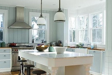 Blue and white kitchen with mahogany counters complete a nautical theme