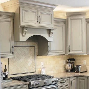 Farmhouse kitchen Taupe Painted Cabinets,Quartz Tops, and Dark Island