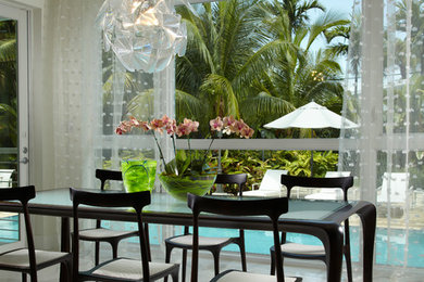 Inspiration for a mid-sized contemporary open plan dining in Miami with white walls, marble floors and white floor.