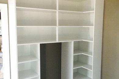 Example of a classic closet design in Other