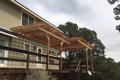 Example of a large classic green two-story wood house exterior design in Denver