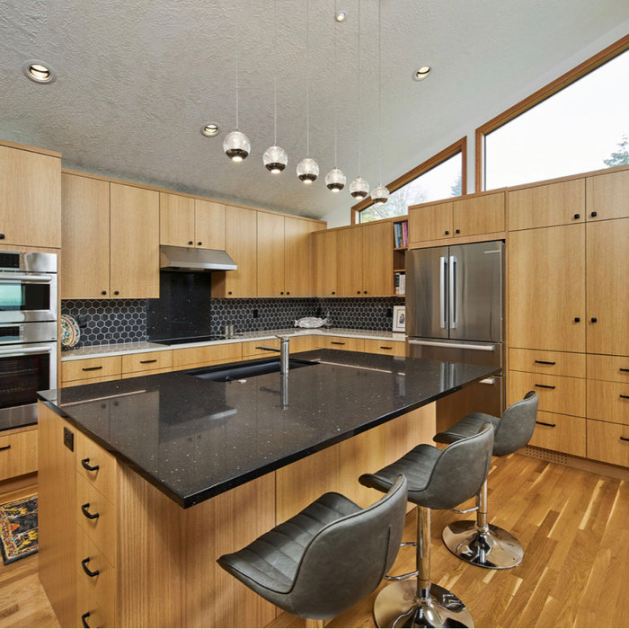 Example of a large l-shaped eat-in kitchen design in Portland with a drop-in sink, open cabinets, light wood cabinets, quartzite countertops, multicolored backsplash, ceramic backsplash, stainless ste