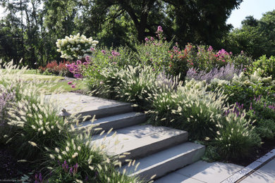 Inspiration for a mid-sized traditional full sun hillside stone garden path in New York for summer.