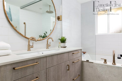 Inspiration for a mid-sized contemporary kids' white tile and porcelain tile mosaic tile floor, beige floor, double-sink and wallpaper bathroom remodel in Seattle with flat-panel cabinets, light wood cabinets, an undermount tub, a one-piece toilet, blue walls, a trough sink, quartz countertops, beige countertops and a built-in vanity
