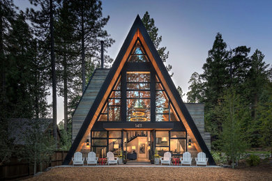 Mountain style glass house exterior photo in Sacramento