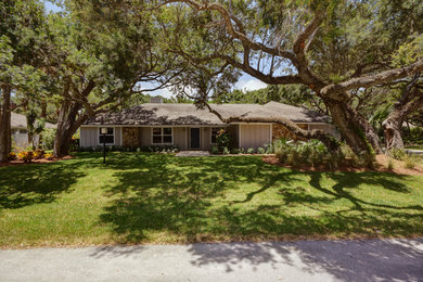 Example of a beach style home design design in Miami