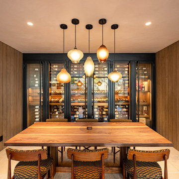 Modern Bronze Steel Wine Wall and Liquor Display in Luxury Custom Home Basement