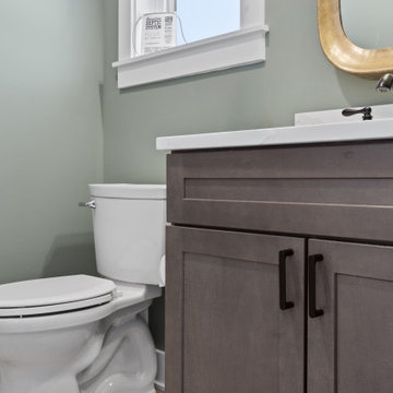 Warm and Cohesive Multi-Bathroom Design In Nokesville