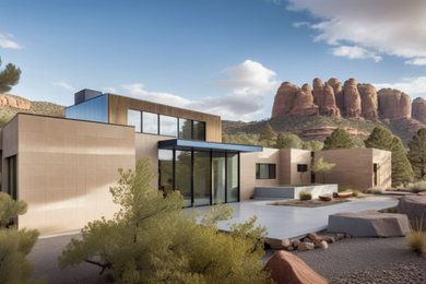 Example of a mid-sized trendy one-story stone exterior home design in Phoenix