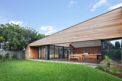Inspiration for a contemporary house exterior in Melbourne with wood siding.