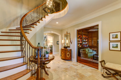 Inspiration for a mid-sized timeless porcelain tile entryway remodel in Raleigh with beige walls and a dark wood front door