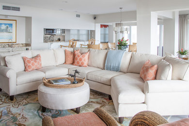 Inspiration for a large beach style open concept living room in Miami with white walls.