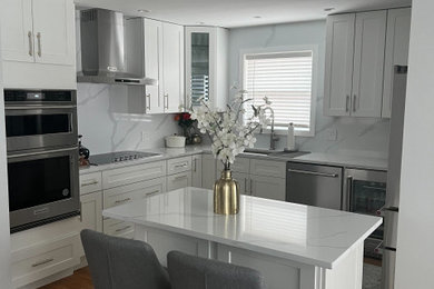 Example of a trendy kitchen design in Chicago with shaker cabinets and white cabinets