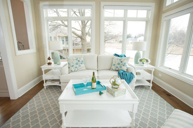 Example of a mid-sized transitional medium tone wood floor and brown floor sunroom design in Chicago with a standard ceiling