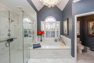 Inspiration for a timeless gray tile and marble tile marble floor, white floor, double-sink and vaulted ceiling walk-in shower remodel in Atlanta with flat-panel cabinets, gray cabinets, an undermount tub, a one-piece toilet, gray walls, an undermount sink, quartz countertops, a hinged shower door, white countertops, a niche and a built-in vanity