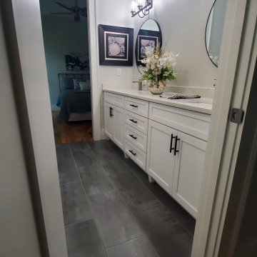 Elegant Shower done with 12x24 tiles and penny rounds.