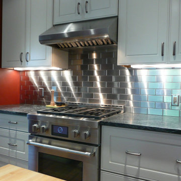 White Kitchens with Stainless Steel Backsplash