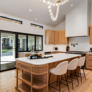 A Marble Island Anchors the Open Kitchen