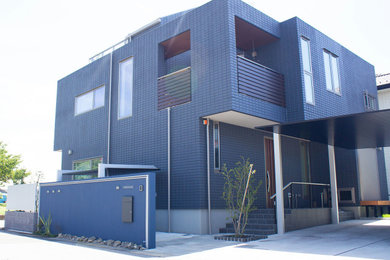 Design ideas for a blue modern two floor detached house in Other with a flat roof and a metal roof.