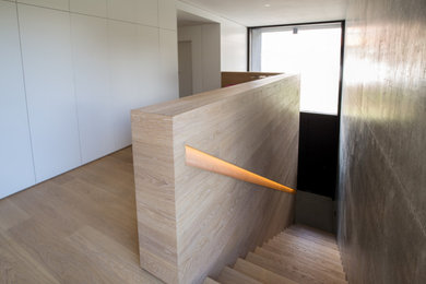 This is an example of a mid-sized contemporary staircase in Cologne.