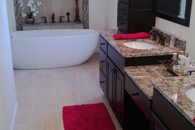 Mid-sized trendy master bathroom photo in Chicago with dark wood cabinets, recessed-panel cabinets, a one-piece toilet, white walls, an undermount sink and quartz countertops