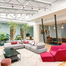 Visite Privée : Un loft parisien aux pièces de vie rénovées