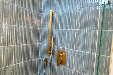 Mid-sized minimalist master green tile and cement tile ceramic tile, gray floor, double-sink and vaulted ceiling bathroom photo in San Diego with shaker cabinets, medium tone wood cabinets, a bidet, green walls, quartzite countertops, a hinged shower door, white countertops, a built-in vanity and an undermount sink