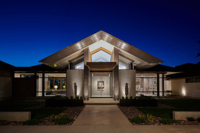 Example of a minimalist exterior home design in Other