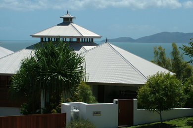 Photo of a tropical home design in Townsville.