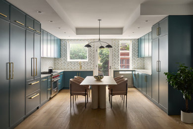 Example of a large transitional u-shaped light wood floor and brown floor open concept kitchen design in New York with an undermount sink, recessed-panel cabinets, blue cabinets, quartz countertops, white backsplash, marble backsplash, paneled appliances, no island and white countertops