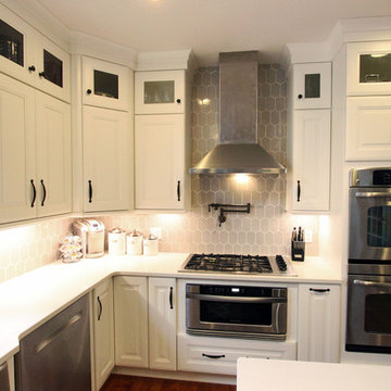 White Kitchen with Espresso Island and Eternia Caringdale Quartz Countertop