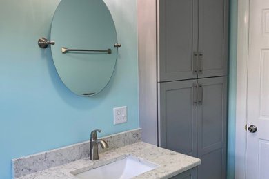 Bathroom - contemporary porcelain tile, white floor and single-sink bathroom idea in Boston with shaker cabinets, gray cabinets, blue walls, an undermount sink, quartz countertops, white countertops and a freestanding vanity