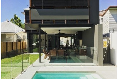 Design ideas for a mid-sized modern pool in Brisbane.