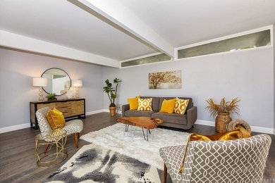 Living room - large transitional formal and open concept dark wood floor living room idea in Los Angeles with gray walls, no fireplace and no tv