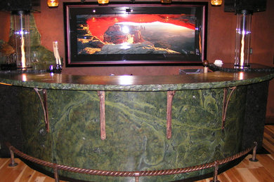 Seated home bar - craftsman medium tone wood floor seated home bar idea in Other with granite countertops