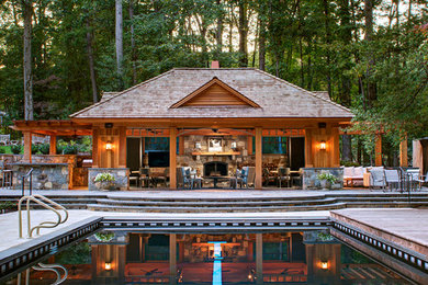 Inspiration for a country backyard rectangular pool in DC Metro with a pool house.