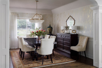 Example of a mid-sized transitional dark wood floor, brown floor and wallpaper enclosed dining room design in Denver