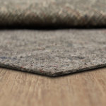 Mohawk Home - Mohawk Home Pet Proof Rug Pad Grey Rug Pad, 0.32, 8' X 10' - Extend the life of your rug and protect your flooring beneath it with Mohawk Home's Pet Proof Reversible Grey Rug Pad. While this style was designed to help keep your rug in place and offer an extra layer of supportive cushion underfoot, it also promises to stop spills and pet accidents from penetrating through your rug to your floor. With a Pet Proof Rug Pad in place, accidents cannot seep through your rug and become trapped underneath, resulting in potential damage to hardwood and carpet. Not only a must have for households with pets, this rug pad is also a smart solution for families with kids and for use in high traffic areas. Consciously crafted out of 90% recycled fibers, this sustainable style is available in variety of sizes and can be cut with scissors for a customized fit.